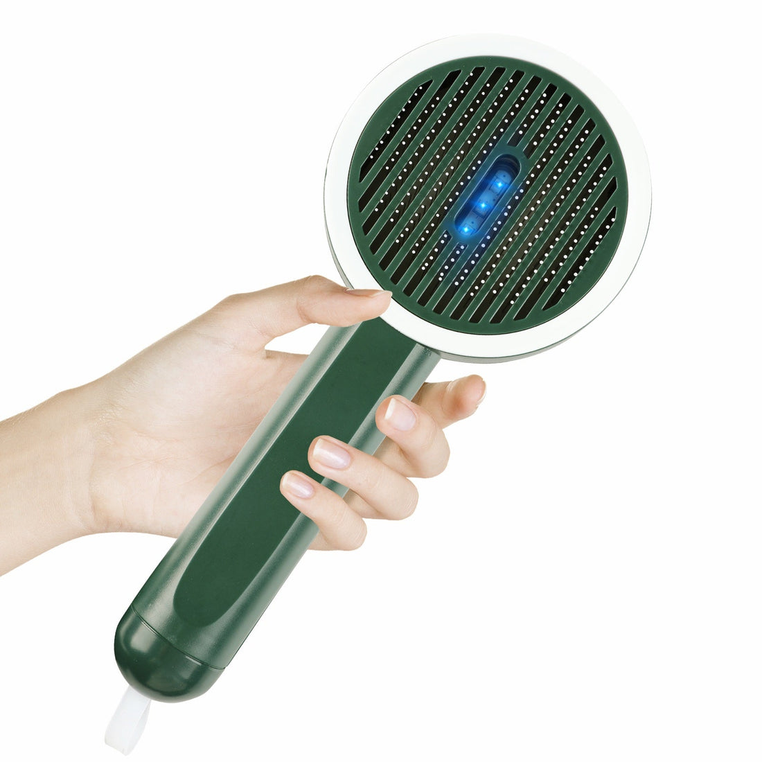Fido Fave self-cleaning slicker brush with UV light, held in hand
