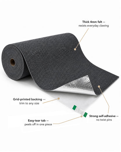 Peeling the easy-tear liner tab off the self-adhesive cat scratch mat